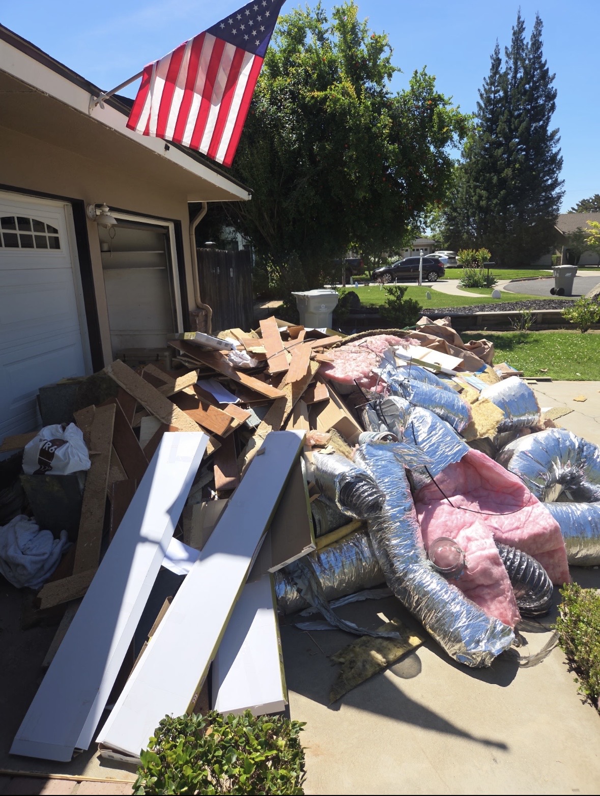 Driveway full of junk before property cleanout